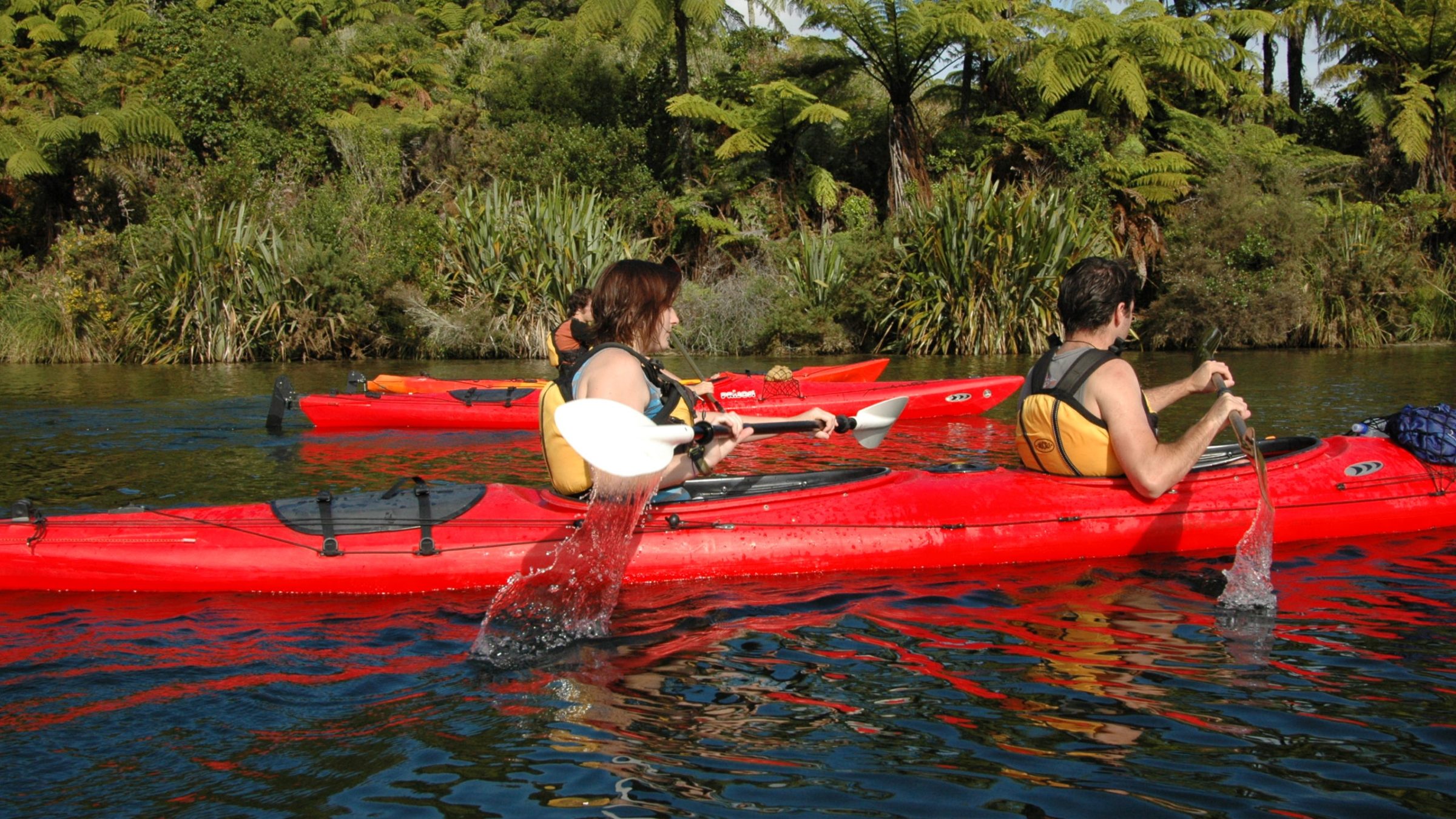 a group of people on a raft in a body of water