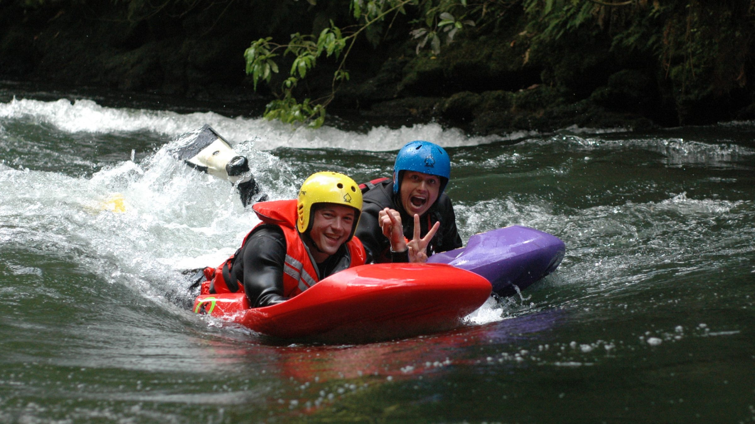 a man riding on a raft in a body of water