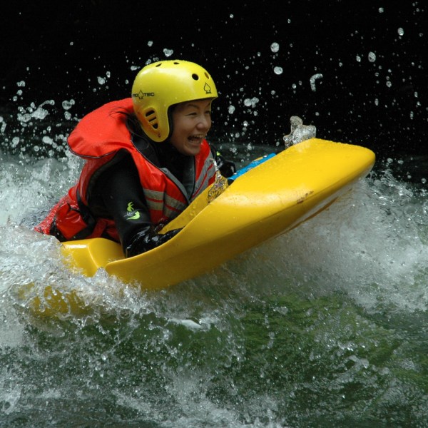 a man riding on a raft in the water