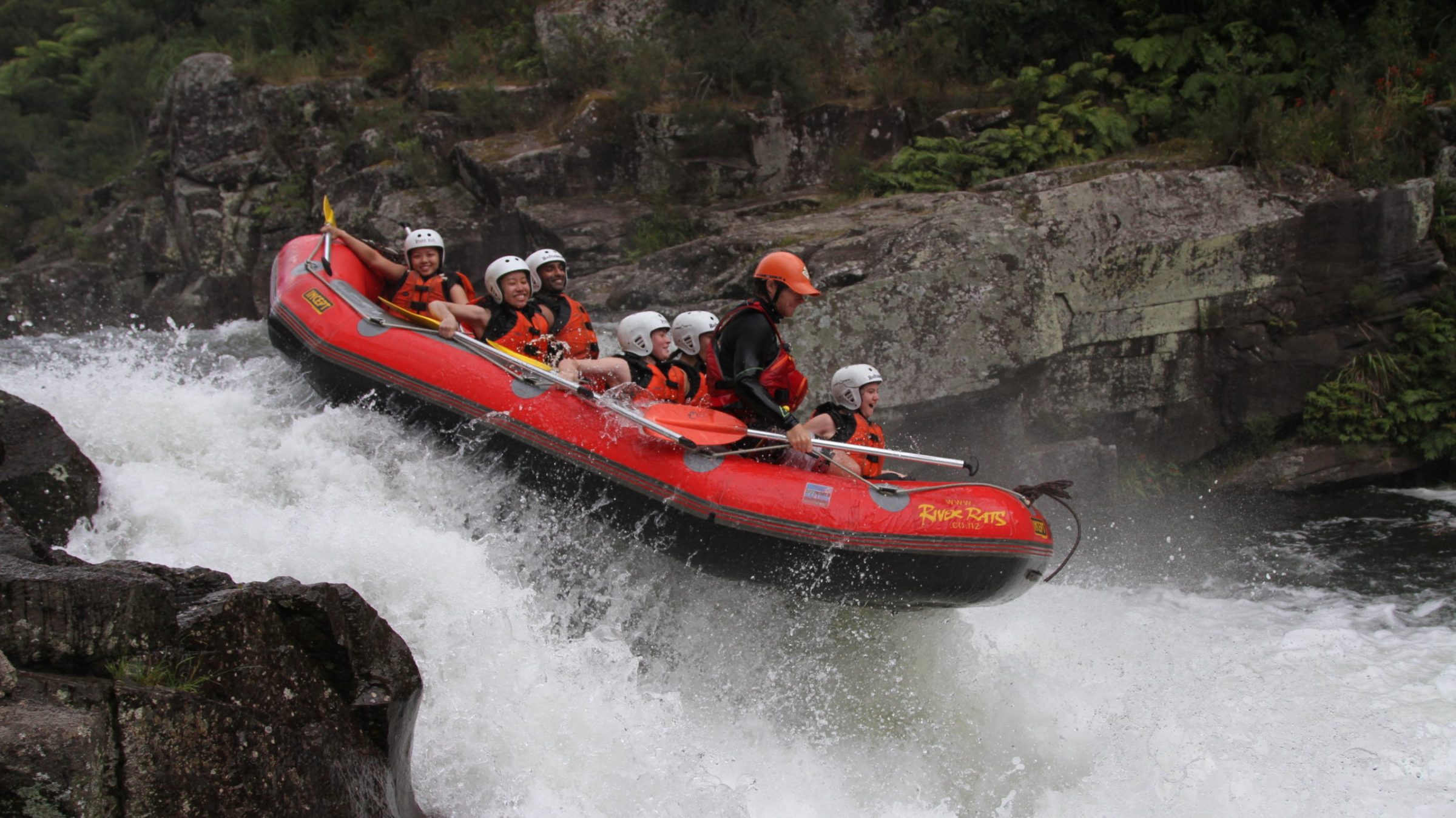 a man riding on a raft in a body of water