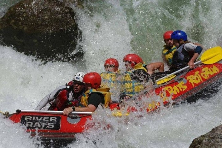 a man riding a snow board on a raft